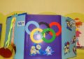 Обложка лэпбука с Олимпийскими кольцами и медалями